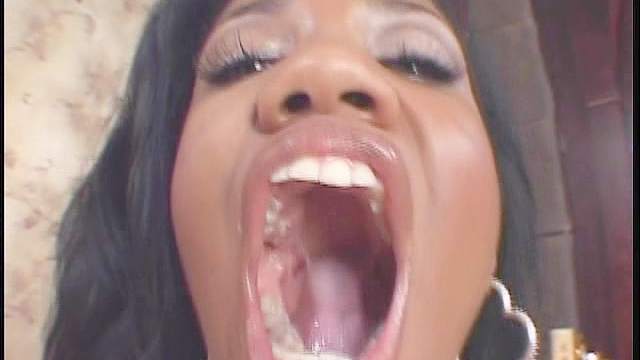 Cumshot in her sexy black mouth