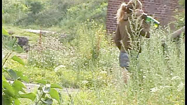 Pretty girl in a skirt pissing in dirt