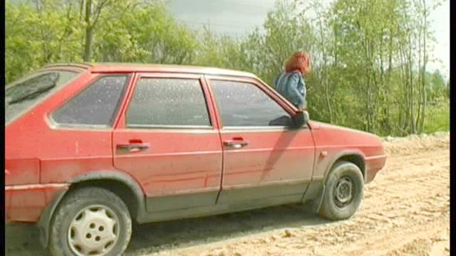 Redhead goes piss in the sand