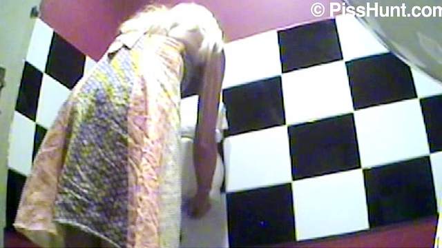 Cute babe filmed pissing by a toilet voyeur