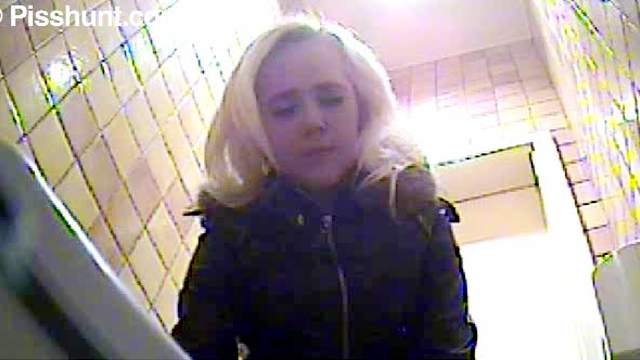 Blonde goes piss in public toilet