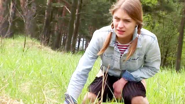 Teen in tights and pigtails pisses outdoors