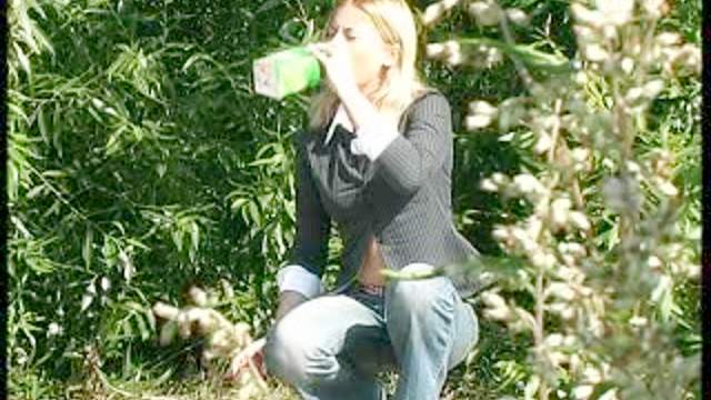 Topless smoker goes piss in voyeur video