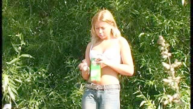 Topless smoker goes piss in voyeur video