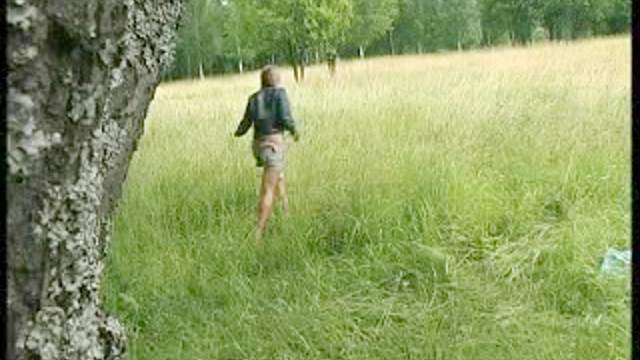 Pussy of a teen pees in a field