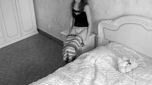 Teen and her teddy bear alone in bedroom