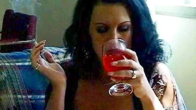 Brunette smokes and plays with her cunt