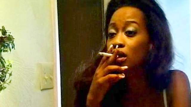 Smoking black girl with small natural tits