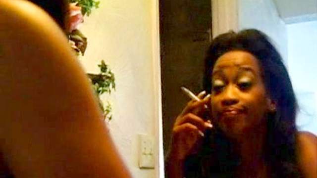 Smoking black girl with small natural tits