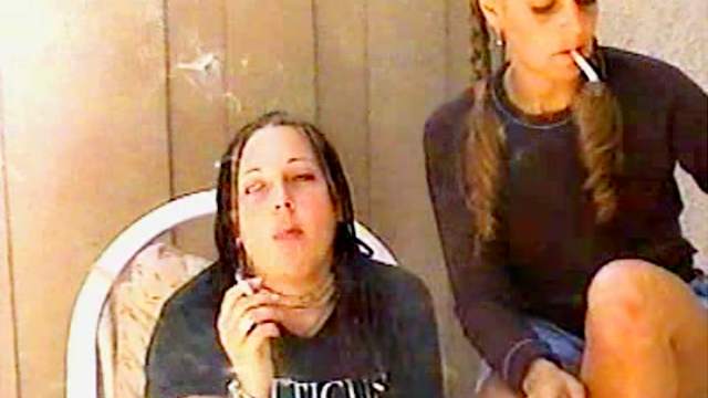 Two sexy chicks smoke together