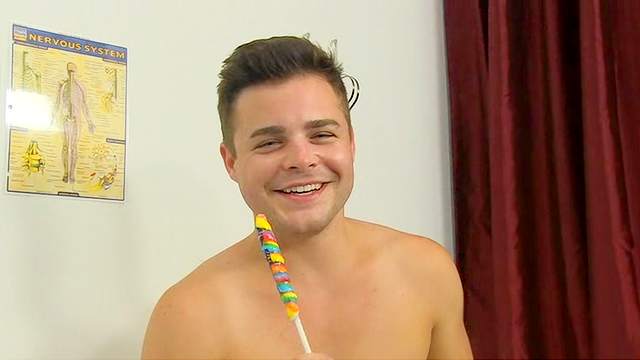 Cute boy sucks lollipop and talks
