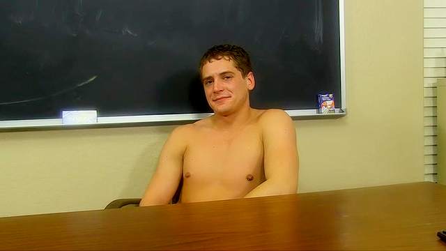 Naked amateur schoolboy in the classroom