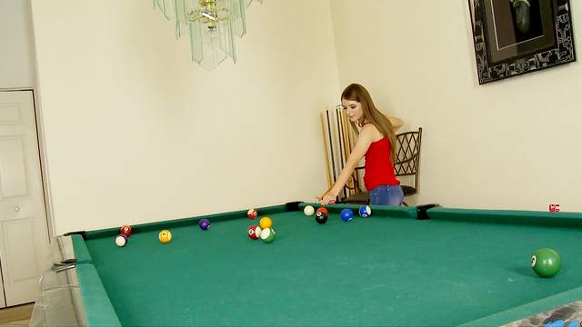 Alice March posing on the nice green pool table