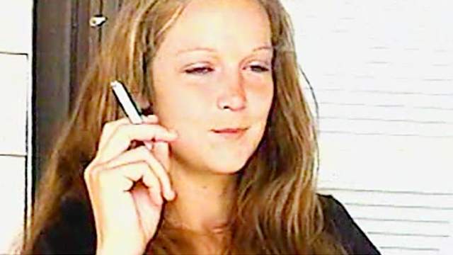 Young lady is smoking her sexy cigarette