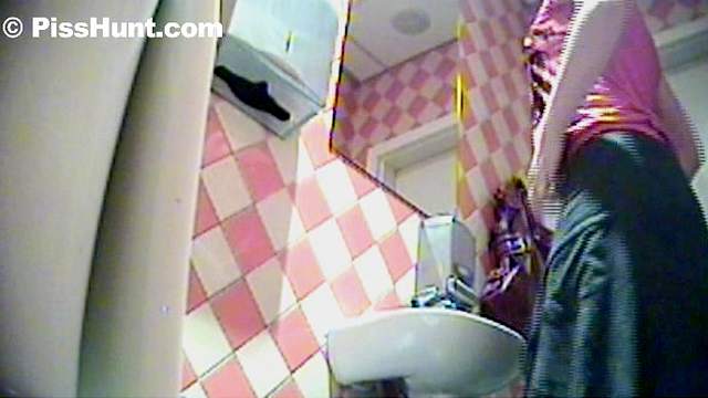 Sweet beauty is pissing in the public toilet