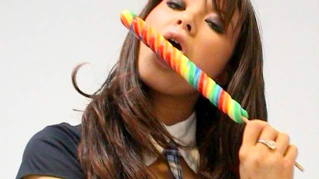 Curly brunette Natalia Forrest is sucking tasty candy