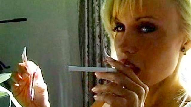 Hot blonde is smoking a cigarette in a hot way