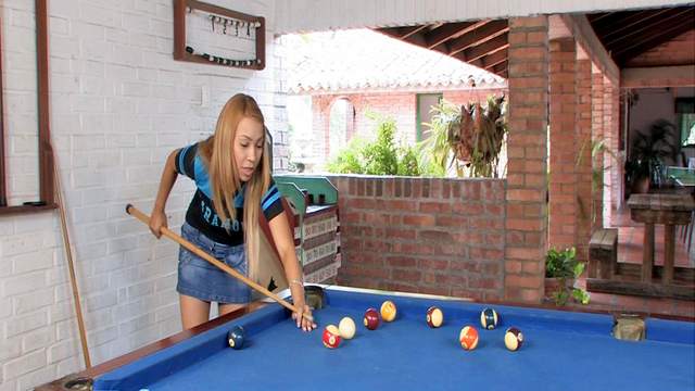 Spicy Latina Tania Spice is posing on the billiard table