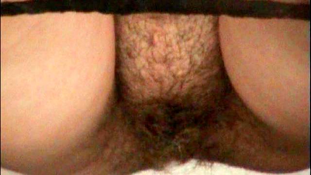 Blonde with hairy pussy is pissing on the cam