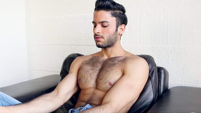 Muscular gay Tony Milan is masturbating his dick