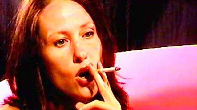 Perverted milf is smoking a cigarette in a hot way