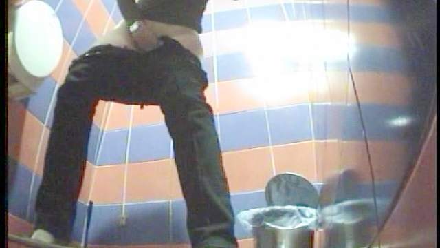 Dressed in black babe is peeing on the spy cam