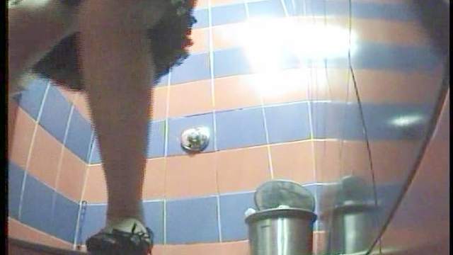 Cute babe is peeing on the camera