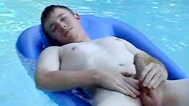 Hardcore dude is swimming in the pool naked