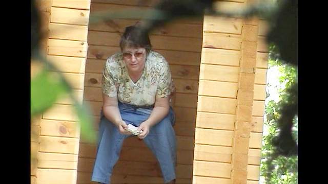 Mature woman is peeing in a reality video