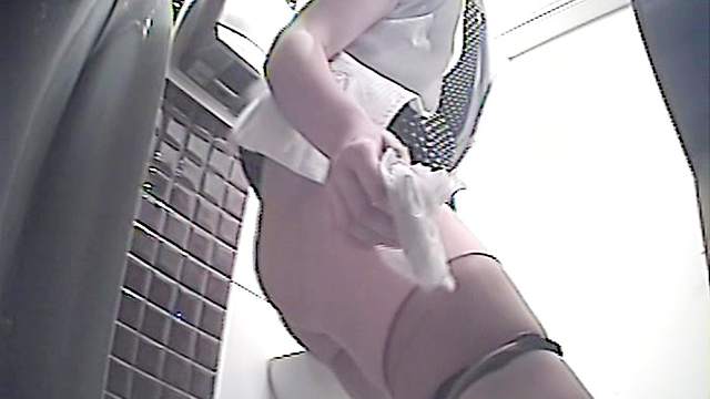 Sweet babe with long legs is peeing on the video