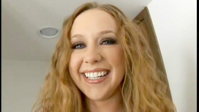 Curly babe Leighlani Red is smiling and making a blowjob