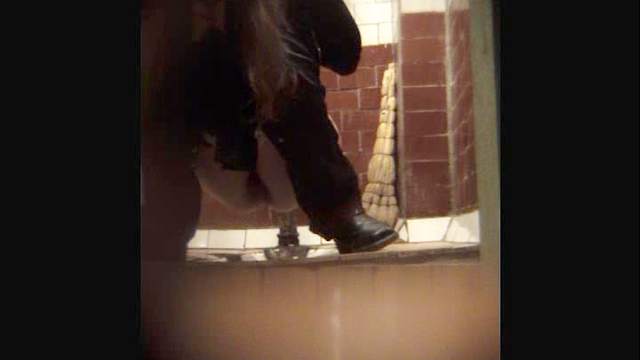 Sweet busty brunette is peeing on the hidden camera