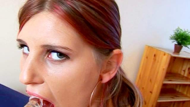 Spicy redhead beauty Simi is sucking her dildo